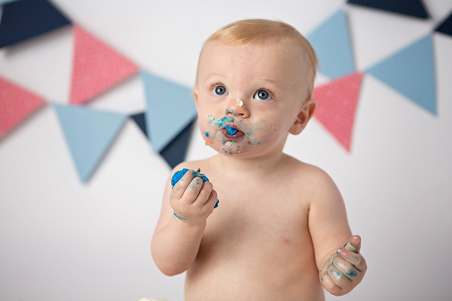 Little boy eating cake