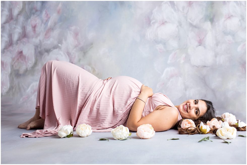 pastel maternity portrait of pregnant woman in flowy dress