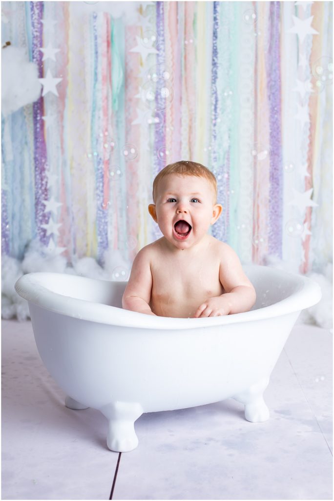 baby in bath after cake smash