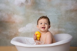 Little boy taking a bath