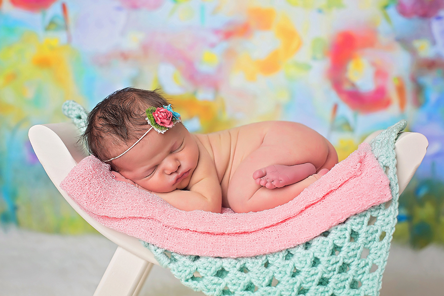 Baby sleeping on pink blanket