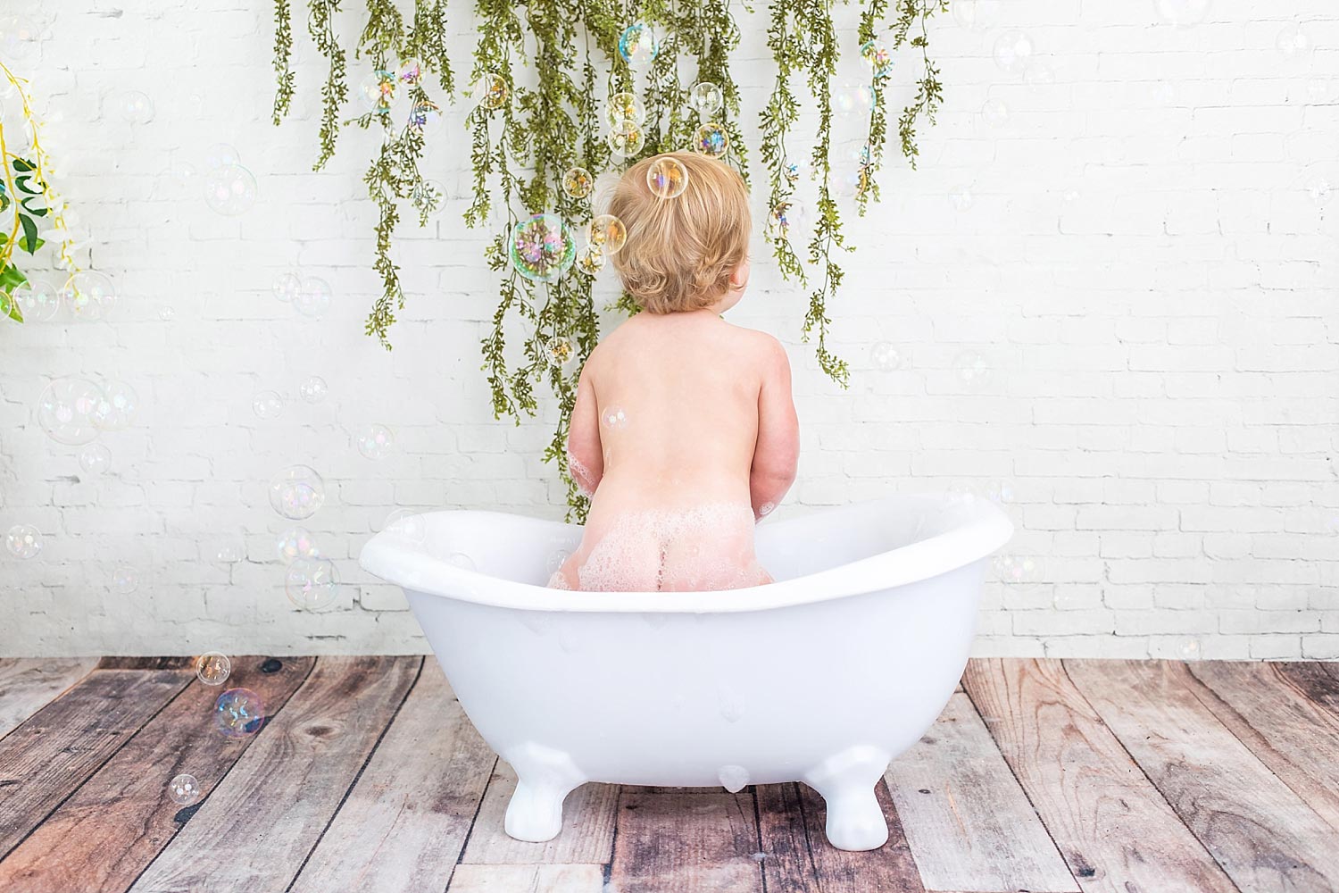 Soapy baby in mini bathtub in Cincinnati Ohio